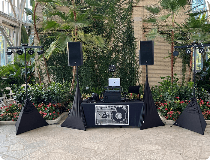 A dj set up in a courtyard.