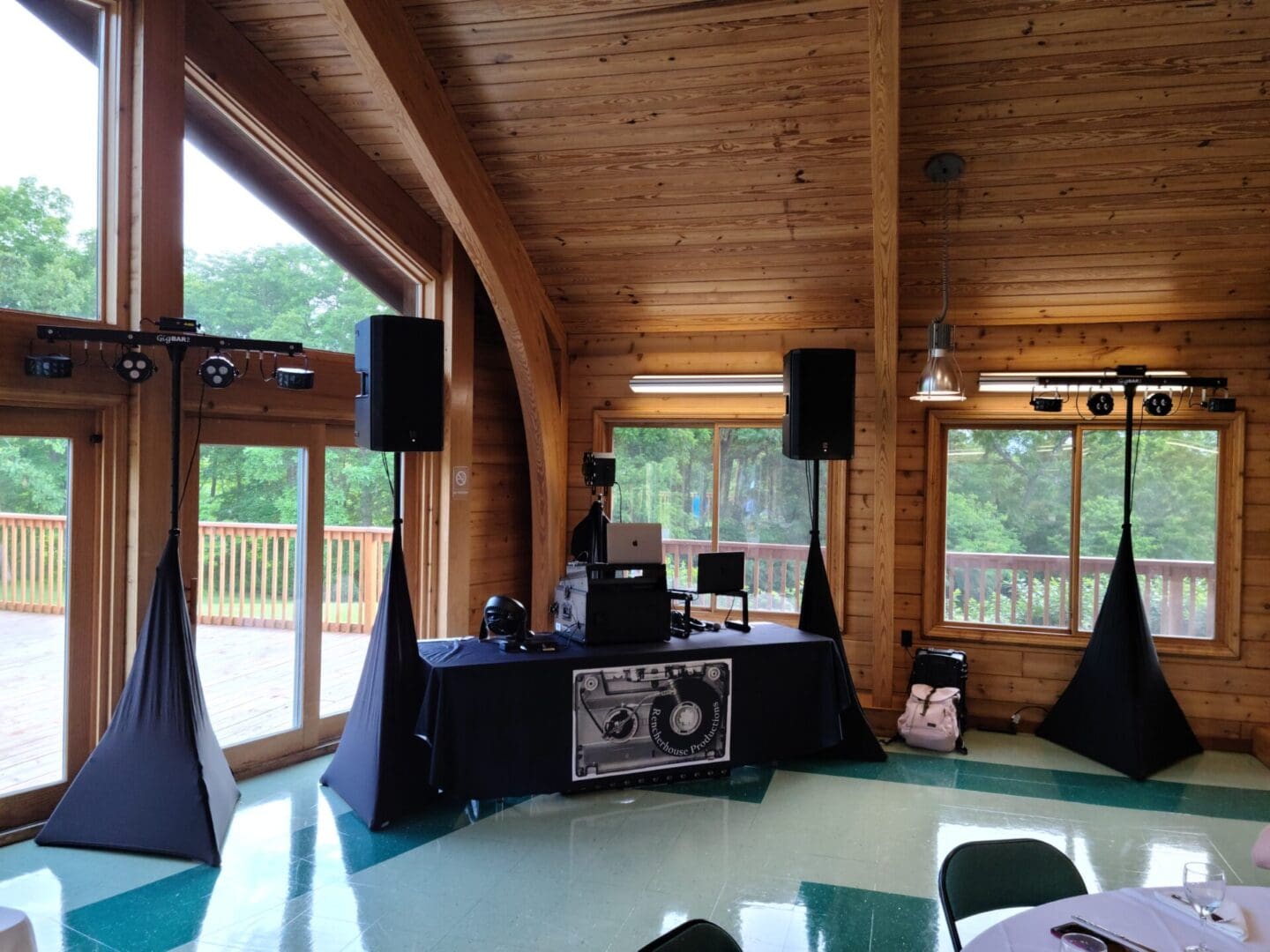 A room with many speakers and tables in it